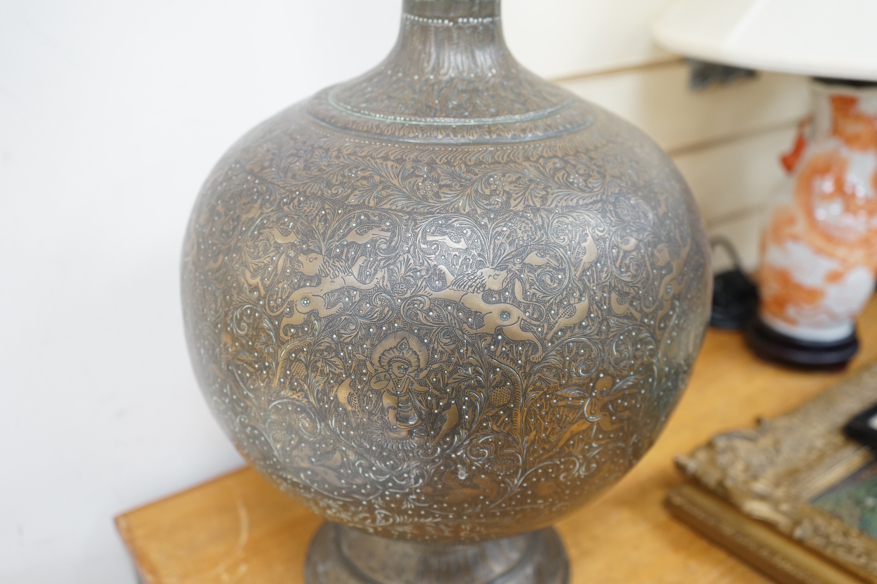 A large Indian repoussé work brass vase, 62cm high. Condition - good